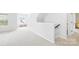 Upstairs hallway with carpeted floors and natural light at 120 Carolinian Dr, Statesville, NC 28677