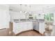 Open-concept kitchen with granite countertops, stainless steel appliances, and breakfast bar at 120 Carolinian Dr, Statesville, NC 28677