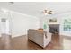 Bright living room with a fireplace, hardwood floors, and a comfortable sofa at 120 Carolinian Dr, Statesville, NC 28677