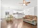 Open-concept living room flowing into a kitchen with granite countertops, and a dining area at 120 Carolinian Dr, Statesville, NC 28677