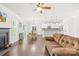 Open-concept living room flowing into a kitchen with granite countertops, and a dining area at 120 Carolinian Dr, Statesville, NC 28677