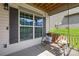 Relaxing porch with a cozy swing and decorative pillows, creating a serene outdoor space at 120 Carolinian Dr, Statesville, NC 28677