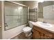 Bathroom featuring a shower-tub, ceramic tile flooring, and a single sink vanity with overhead lighting at 1228 N Dobys Bridge Rd, Fort Mill, SC 29715