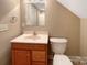 Bathroom with traditional vanity, mirror, toilet, and walk-in shower at 1228 N Dobys Bridge Rd, Fort Mill, SC 29715