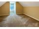 Cozy carpeted bedroom featuring natural light and a private, quiet atmosphere at 1228 N Dobys Bridge Rd, Fort Mill, SC 29715