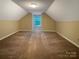 Cozy carpeted bonus room featuring natural light and a private, quiet atmosphere at 1228 N Dobys Bridge Rd, Fort Mill, SC 29715