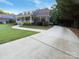 Charming brick home featuring a well-manicured lawn, covered porch, and mature trees at 1228 N Dobys Bridge Rd, Fort Mill, SC 29715