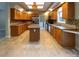 Well-appointed kitchen featuring an island, wood cabinetry, and stainless steel appliances at 1228 N Dobys Bridge Rd, Fort Mill, SC 29715