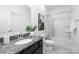 Clean bathroom featuring a granite countertop vanity, framed mirror and shower with tub at 12548 Gotland Rd # 327, Midland, NC 28107