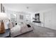 Spacious bedroom with plush carpeting, a large window, and stylish decor elements at 12548 Gotland Rd # 327, Midland, NC 28107