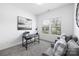 Cozy bedroom featuring plush carpet, a comfortable chair, and a bright, sunny window at 12548 Gotland Rd # 327, Midland, NC 28107