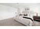Light-filled bedroom features a large bed, neutral decor, and modern furniture at 12548 Gotland Rd # 327, Midland, NC 28107