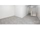 Bright hallway with neutral carpet and white walls leading to bedrooms at 12548 Gotland Rd # 327, Midland, NC 28107
