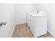 Bright laundry room with flooring and modern appliances at 12548 Gotland Rd # 327, Midland, NC 28107