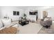 Contemporary living room with stylish furnishings, area rug, and open floor plan with dining area access at 12548 Gotland Rd # 327, Midland, NC 28107