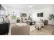 Cozy living room with neutral tones, stylish furniture, plush seating, and bright natural light at 12548 Gotland Rd # 327, Midland, NC 28107