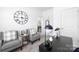 Bright office space with comfortable seating area, large black desk, and a stylish black lamp at 12548 Gotland Rd # 327, Midland, NC 28107