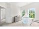 Cozy bedroom with a gray dresser, a playful ' tent, and two bright windows at 13920 Winmau Ln, Huntersville, NC 28078