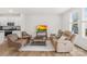 Bright living room with comfortable seating, a modern TV, and an open floor plan concept at 13920 Winmau Ln, Huntersville, NC 28078