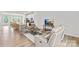 Bright living room with comfortable seating, a modern TV, and an open floor plan concept at 13920 Winmau Ln, Huntersville, NC 28078