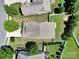 Aerial view of a house with a well-maintained lawn, fenced backyard, and mature trees for outdoor living at 15120 Cavanshire Trl, Charlotte, NC 28278