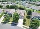 This home features a two-car garage, well-maintained landscaping, and a neighborhood with white fences at 15120 Cavanshire Trl, Charlotte, NC 28278