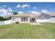 Spacious backyard featuring a covered patio and well-maintained lawn at 15120 Cavanshire Trl, Charlotte, NC 28278