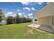 Backyard featuring a covered patio and plenty of green space at 15120 Cavanshire Trl, Charlotte, NC 28278
