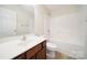 Bathroom features a single sink vanity and a shower/tub combination at 15120 Cavanshire Trl, Charlotte, NC 28278