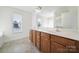 Spacious bathroom with double vanity sinks and plenty of natural light at 15120 Cavanshire Trl, Charlotte, NC 28278