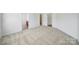 Large empty bedroom with lots of carpet and access to the bathroom and walk-in closet at 15120 Cavanshire Trl, Charlotte, NC 28278