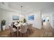 The dining area features hardwood floors, wainscoting and contemporary decor at 15120 Cavanshire Trl, Charlotte, NC 28278