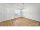Bright dining area with tray ceiling, hardwood floors, wainscoting and lots of natural light at 15120 Cavanshire Trl, Charlotte, NC 28278
