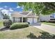Charming home features a two-car garage and well-manicured lawn at 15120 Cavanshire Trl, Charlotte, NC 28278