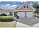 Charming home featuring stone accents, shingle details, an attached two-car garage and manicured landscaping at 15120 Cavanshire Trl, Charlotte, NC 28278