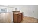 The kitchen boasts hardwood floors, granite countertops, wood cabinets and stainless steel appliances at 15120 Cavanshire Trl, Charlotte, NC 28278