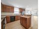 Spacious kitchen with stainless steel appliances, granite countertops, and hardwood floors at 15120 Cavanshire Trl, Charlotte, NC 28278