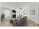 Comfortable living room setup with neutral tones, a fireplace, and an abundance of natural light at 15120 Cavanshire Trl, Charlotte, NC 28278