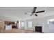 Spacious living room with hardwood floors, fireplace, and an open view into the kitchen at 15120 Cavanshire Trl, Charlotte, NC 28278