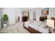 Staged bedroom featuring a large bed, carpet floors, art, and furniture at 15120 Cavanshire Trl, Charlotte, NC 28278