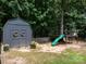 Backyard shed near a playground with a slide at 170 Eagle Dr, Salisbury, NC 28144