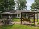 Large backyard with a patio set, wooden swing, screen porch and a well-maintained lawn at 170 Eagle Dr, Salisbury, NC 28144