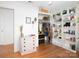 Bedroom with decorative shelves, a pink dresser, and ample closet space at 170 Eagle Dr, Salisbury, NC 28144