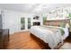 Bright bedroom with access to private balcony and a modern farmhouse aesthetic at 170 Eagle Dr, Salisbury, NC 28144