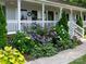 Close up of the front porch with lush landscaping and a stone walkway at 170 Eagle Dr, Salisbury, NC 28144