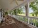 Spacious front porch with rocking chairs, ceiling fans, and views of the surrounding greenery at 170 Eagle Dr, Salisbury, NC 28144