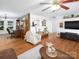 Inviting living room features hardwood floors, white walls, with seamless flow to the kitchen at 170 Eagle Dr, Salisbury, NC 28144