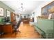 Open-concept living area with hardwood floors and a fireplace, perfect for entertaining at 170 Eagle Dr, Salisbury, NC 28144