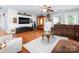 Living room featuring hardwood floors, a ceiling fan, a mounted TV and comfortable seating at 170 Eagle Dr, Salisbury, NC 28144