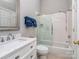 Clean bathroom featuring a shower-tub combination, a vanity sink with white cabinets and countertops at 17709 Sedona Way, Cornelius, NC 28031